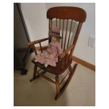 Vintage Wooden Rocking Chair with Porcelain Doll in Floral Dress