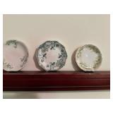 Set of 8 Antique Decorative Porcelain Butter Pat Pad Chip Plates with Floral Designs and Shelf