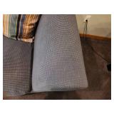 Used Sofa with Striped Throw Pillows