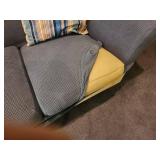 Used Sofa with Striped Throw Pillows