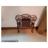 Ornate Wrought Iron Magazine Rack with Decorative Motif