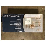 Hampton Bay Pavlen 24 in. 3-Lights Antique Brass Vanity Light with Clear Glass Shades  Customer Returns See Pictures