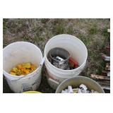 Collection of Electric Fence Supplies Including Wire, Insulators, and Energizer