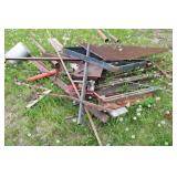 Collection of Steel Beams, Metal Scraps, and a Large Propane Tank