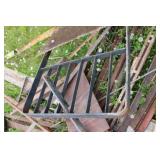 Collection of Steel Beams, Metal Scraps, and a Large Propane Tank