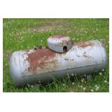 Collection of Steel Beams, Metal Scraps, and a Large Propane Tank