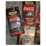 Collection of Coca-Cola Themed Matchbox Cars and Memorabilia