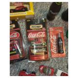 Collection of Coca-Cola Themed Matchbox Cars and Memorabilia