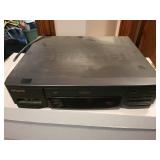 Hitachi VCR with Illuminated Shuttle Remote and 74 VHS Movie Collection