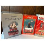 Collection of Coca-Cola Memorabilia: Tins, Snow Globes, and Die-Cast Models