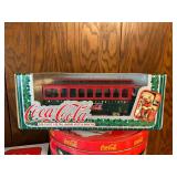 Collection of Coca-Cola Memorabilia: Tins, Snow Globes, and Die-Cast Models
