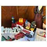 Collection of Christmas Decorations Including Santa Figurines and M&M Ornaments