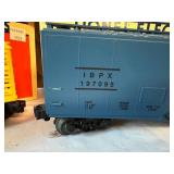 Lionel Train Set - Looney Tunes and IBP Boxcar with Caboose