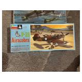 Collection of 3 Vintage Aircraft Model Kits: P-39 Airacobra, Junkers Ju 88, AC-47
