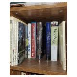 Collection of Historical and Train-Themed Books on Wooden Bookshelf