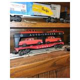 Set of Vintage Lionel Train Cars Including Auto-Loader, Tanker, and Dump Car