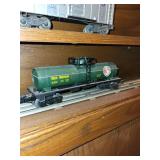 Set of Vintage Lionel Train Cars Including Auto-Loader, Tanker, and Dump Car