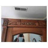 Antique Wooden Armoire with Intricate Carvings and Mirror