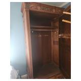 Antique Wooden Armoire with Intricate Carvings and Mirror