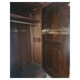 Antique Wooden Armoire with Intricate Carvings and Mirror