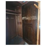 Antique Wooden Armoire with Intricate Carvings and Mirror