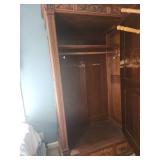 Antique Wooden Armoire with Intricate Carvings and Mirror