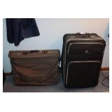 American Tourister Brown Garment Bag and Leisure International Black Upright Suitcase