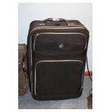 American Tourister Brown Garment Bag and Leisure International Black Upright Suitcase