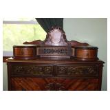 Antique Mahogany Dresser with Intricate Carvings and Brass Handles