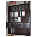 Collection of Vintage Music Cassette Tapes with Wooden Rack