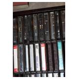 Collection of Vintage Music Cassette Tapes with Wooden Rack