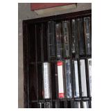 Collection of Vintage Music Cassette Tapes with Wooden Rack