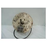 extension cord with outlet on wooden reel