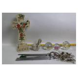 Decorative Collection: Cross Statue, Bird Figurine, and Glass Paperweights