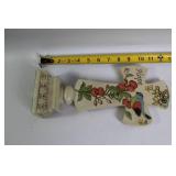 Decorative Collection: Cross Statue, Bird Figurine, and Glass Paperweights