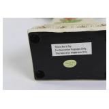 Decorative Collection: Cross Statue, Bird Figurine, and Glass Paperweights