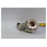 Decorative Collection: Cross Statue, Bird Figurine, and Glass Paperweights