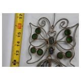 Decorative Collection: Cross Statue, Bird Figurine, and Glass Paperweights