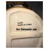 Christmas Ceramic Collectibles Set with Santa, Carolers, and Stein