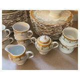 64-Piece Palate & Plate Fine Porcelain Dinnerware Set with Gold Trim