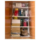 All Contents of Cupboards. A Collection of Household and Cleaning Supplies with Assorted Caps and Clothing