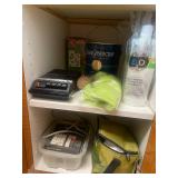 All Contents of Cupboards. A Collection of Household and Cleaning Supplies with Assorted Caps and Clothing