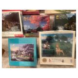 Collection of 13 Assorted Jigsaw Puzzles including Thomas Kinkade Designs