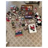 Large Collection of Christmas Decor Including Snow Village and Santa Figurines