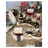 Large Collection of Christmas Decor Including Snow Village and Santa Figurines