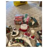 Large Collection of Christmas Decor Including Snow Village and Santa Figurines