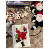 Large Collection of Christmas Decor Including Snow Village and Santa Figurines