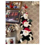 Large Collection of Christmas Decor Including Snow Village and Santa Figurines