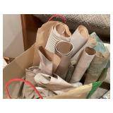 Collection of Assorted Wrapping Paper Rolls and Gift Wraps