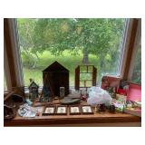 Diverse Collection of Decorative Figurines, Framed Art, and Miscellaneous Household Items